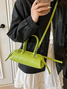 Fluorescent green baguette bag in retro Boston style with double handles and shoulder strap