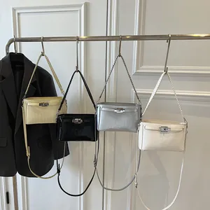 Detailed comparison of four textured crossbody bags in beige, black, grey and white