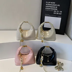 Fashionable patent leather crossbody saddle bags in four colors with embossed letters