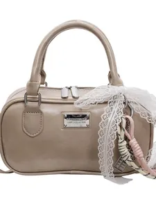 Beige bowling handbag for women with elegant lace charms and silver logo plate
