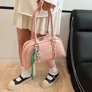Pink leather hobo bag with bear charm and YAZIANDI logo for summer fashion