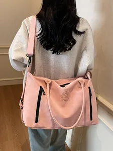 Pink minimalist large capacity travel bag for gym and sports with black zipper details