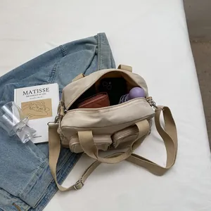 Top view of cream white multi-pocket handbag showing spacious interior and daily essentials
