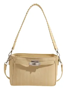 Elegant cream textured handbag with metal turn-lock and woven strap on white background