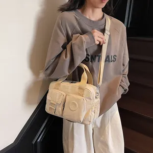 Beige multi-pocket nylon handbag with large capacity and adjustable crossbody strap
