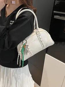 White Boston underarm bag with decorative woven seams and cute bear charm for women