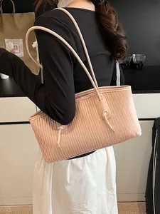 Pink plissé tote bag with wave texture and slim shoulder straps for daily fashion