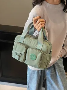 Chic sage green nylon handbag with multiple zip pockets for daily casual commute use