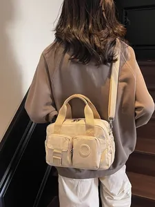 Versatile beige nylon handbag with multi-pocket design and adjustable shoulder strap for women