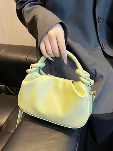 Chic lime green pleated handbag with knotted handle and fashion text for women