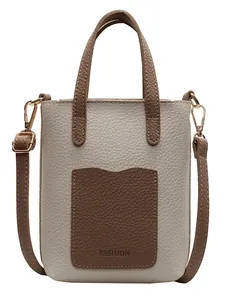 Sac seau minimaliste beige et marron avec texture litchi et détails dorés en métal