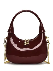 Glossy burgundy crescent hobo bag with a gold chain strap and a sleek mirror finish