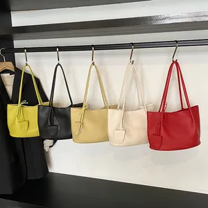 Minimalist faux leather tote bag in five macaron colors with hanging tassel and long handles