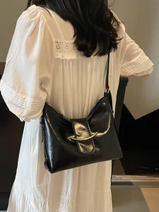 Fashionable black glossy leather bucket bag with gold metal buckle for women