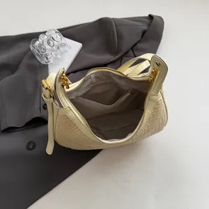 Close-up of woven dumpling bag interior showing dark lining and functional zipper pocket