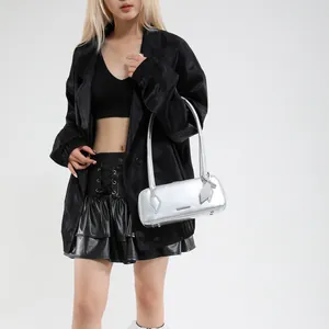 Close-up of metallic silver bowling bag with Fashion & Bags lettering on sleek finish