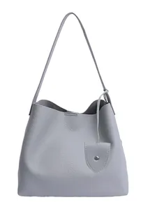 Grey lychee texture leather tote bag with elegant shoulder strap and decorative charm