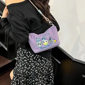 Detail of purple nylon bag with colorful cat embroidery and Pretty Kitty text