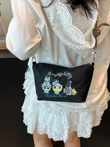 Japanese style black nylon crossbody bag with cat embroidery and adjustable strap