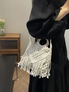 Bohemian fringe woven handbag with round wooden handles and hollow tassel design
