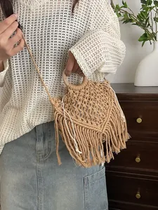 Bohemian handwoven fringe bag with wooden handles and crossbody strap in beige