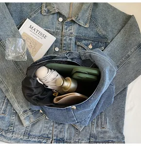 Large capacity denim tote bag interior showing space for water bottle and umbrella