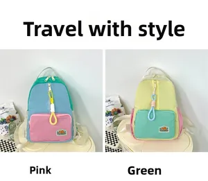 Detail of color-blocked canvas backpacks in pink and green with brand logo labels