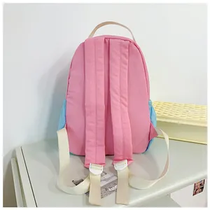 Detailed back view of a pink and blue nylon backpack with adjustable padded shoulder straps