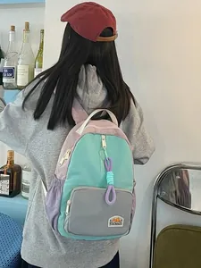 Minimalist color-block backpack for women and students in mint green and light purple