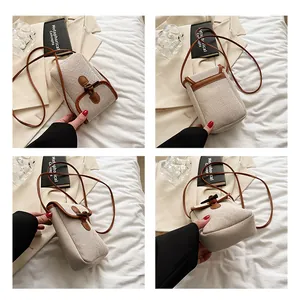 Detailed views of a minimalist canvas crossbody bag with vintage horn buckle and leather trim