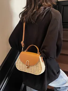 Retro woven crossbody bag with brown leather flap and golden lock for summer beach vacations