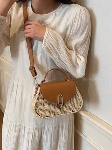 Retro woven beige straw handbag with brown leather strap and elegant gold metal buckle
