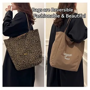 Reversible leopard print canvas tote bag with brown side and minimalist shoulder straps