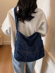 Retro washed denim messenger bag with contrast stitching and adjustable strap