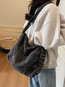Large washed denim crossbody bag in dark grey with contrast stitching for women