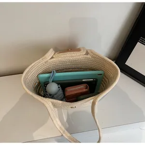 Interior view of beige woven tote bag showing large capacity for tablet and daily items