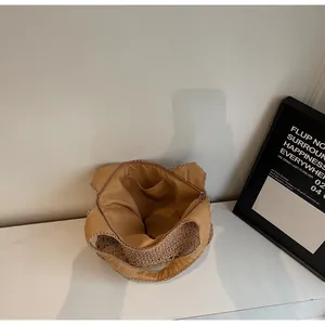 Internal view of woven tote bag showing fabric lining and secure zipper pocket