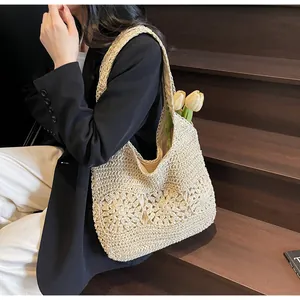 Detail of hand-woven beige tote bag featuring floral crochet patterns and cotton lining