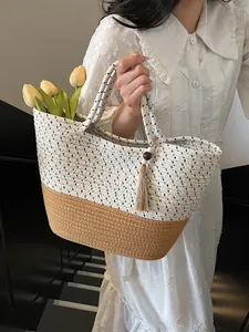 Handcrafted woven tote bag with fringe charm and summer beach aesthetic for women
