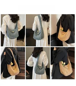 Detailed views of crochet knit hobo bag in blue and beige with floral accents