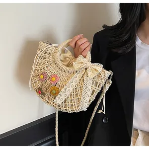 Detail of hand-woven straw bag with crochet floral accents and drawstring lining