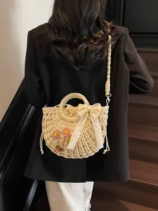 Pastel beige straw woven handbag with floral accents and lace bow for beach vacation