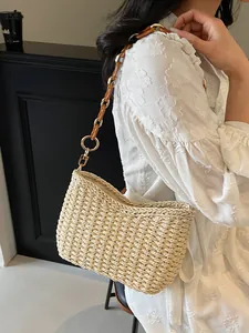 Straw woven shoulder bag with resin chain strap for beach vacation or commute