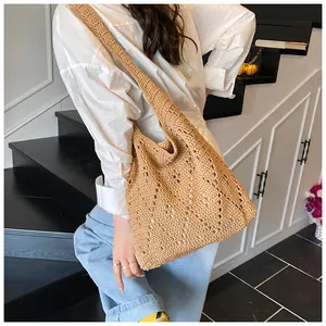 French style hollow crochet cotton tote bag shown on model for seaside vacation look