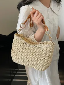 Straw shoulder bag with amber resin chain and woven texture for summer beach vacation