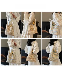 Model wearing striped crochet tote bag with lace bow detail and hollow knit pattern