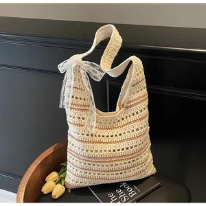 Detail of striped crochet tote with lace bow and woven texture on a cozy background