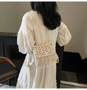 Detailed side view of bohemian cream macramé woven bag for beach vacation style