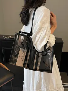 Transparent large PVC tote bag with black inner pouch and leather shoulder straps