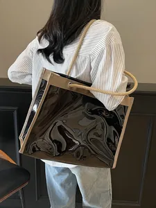 Large black transparent jelly tote bag with rope handles for beach and vacation use